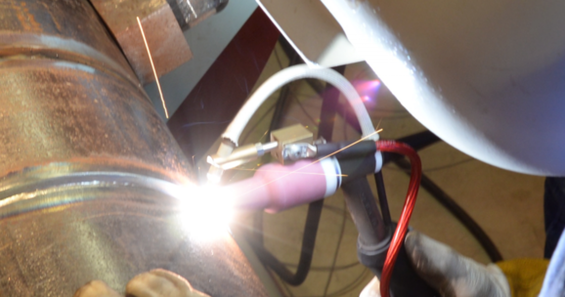 Union welder welding a seam on a copper pipe